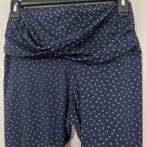 Nike Yoga pants. Size Medium. 7/8 length. Dark blue colored with white designs